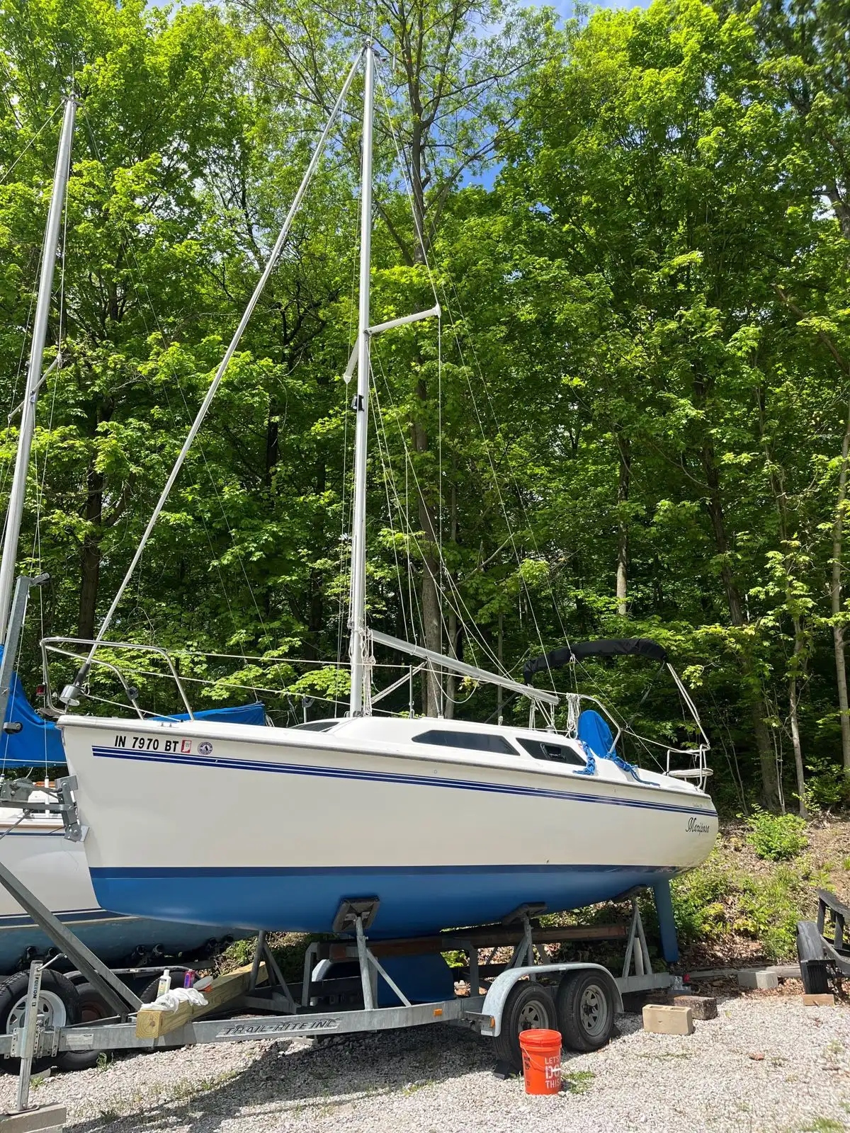 Windward founder Joseph Shirey standing aboard a sailboat